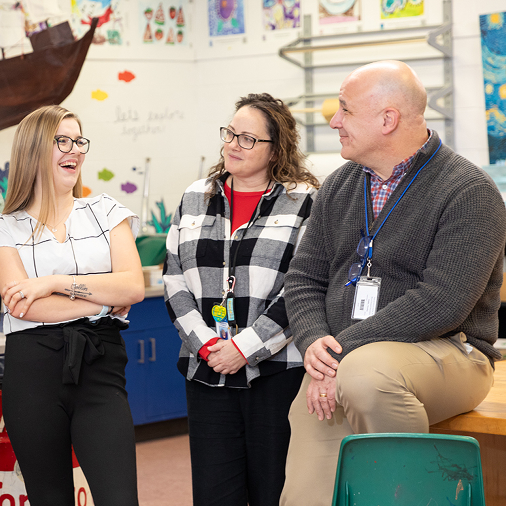 Teachers at a workshop discussing education